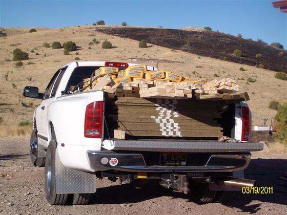 Truck loaded with about 35 sheets pressed wood, also 30 sacks of ready mix, and 2x4, ect.jpg