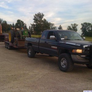 1997_dodge_hauling_a_tractor_and_chipper